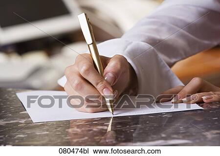 close-up of hotel receptionist writing down note View Large Photo Image Stock Image - close-up of hotel receptionist writing down note. Fotosearch