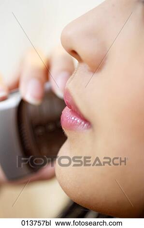 close-up of lips and nose of woman with mobile View Large Photo Image Stock Image - close-up of lips and nose of woman with mobile. Fotosearch