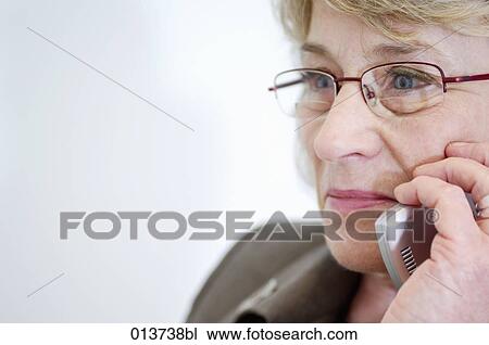 close-up of mature businesswoman with mobile View Large Photo Image Stock Image - close-up of mature businesswoman with mobile. Fotosearch
