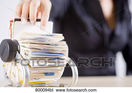 close-up of young businesswoman scrolling through rolodex View Large Photo Image Stock Image - close-up of young businesswoman scrolling through rolodex. Fotosearch