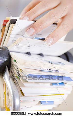 close-up of young businesswoman scrolling through rolodex View Large Photo Image Stock Image - close-up of young businesswoman scrolling through rolodex. Fotosearch