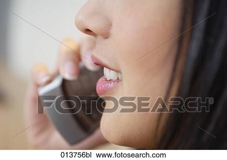 close-up on mouth of woman talking on telephone View Large Photo Image Stock Image - close-up on mouth of woman talking on telephone . Fotosearch