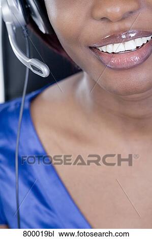detail of black call center agent with headset View Large Photo Image Stock Image - detail of black call center agent with headset. Fotosearch