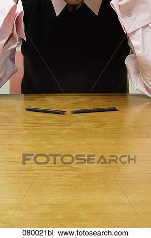detail of depressed businessman sitting at table with broken pencil in foreground View Large Photo Image Stock Image - detail of depressed businessman sitting at table with broken pencil in foreground. Fotosearch