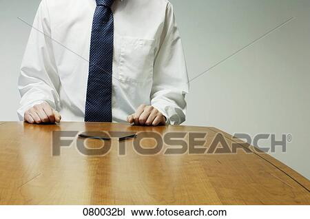 detail of executive in shirt and tie sitting at desk with broken pencil in foreground View Large Photo Image Stock Image - detail of executive in shirt and tie sitting at desk with broken pencil in foreground. Fotosearch