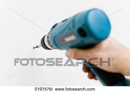 detail of man using cordless screwdriver View Large Photo Image Stock Image - detail of man using cordless screwdriver. Fotosearch