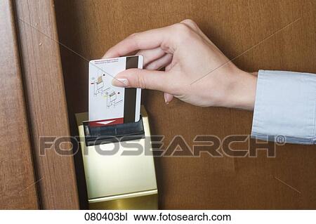detail of young businesswoman opening door to hotel room with key card View Large Photo Image Stock Image - detail of young businesswoman opening door to hotel room with key card. Fotosearch