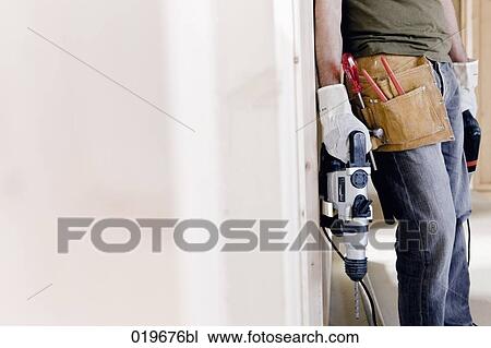 detail of young man with electric drill and other construction tools View Large Photo Image Stock Image - detail of young man with electric drill and other construction tools. Fotosearch