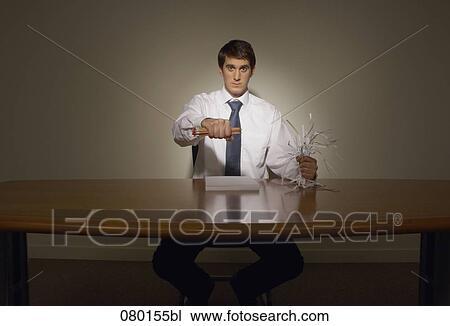 determined businessman at desk holing pencils and shredded paper View Large Photo Image Stock Image - determined businessman at desk holing pencils and shredded paper. Fotosearch