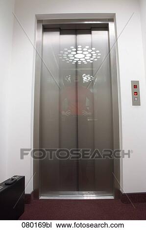 double exposure of businesswoman standing in elevator in office building View Large Photo Image Stock Image - double exposure of businesswoman standing in elevator in office building. Fotosearch