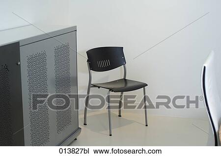 empty chair and cabinet in office meeting room View Large Photo Image Stock Image - empty chair and cabinet in office meeting room. Fotosearch