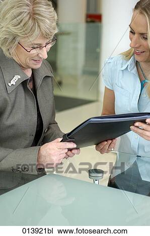 executive handing over file to boss View Large Photo Image Stock Image - executive handing over file to boss. Fotosearch