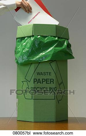 female hand putting confidential file in wastebasket for paper recycling View Large Photo Image Stock Image - female hand putting confidential file in wastebasket for paper recycling. Fotosearch