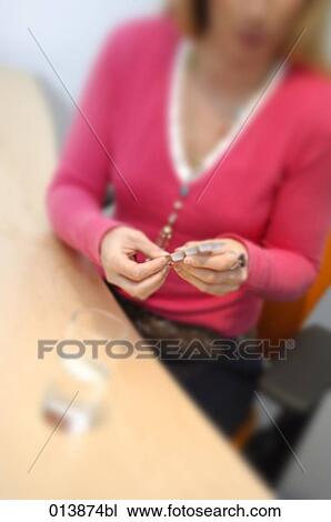 female office worker taking some pills View Large Photo Image Stock Image - female office worker taking some pills. Fotosearch