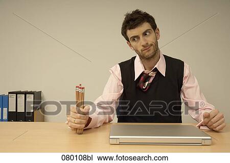 frustrated businessman holding pencils View Large Photo Image Stock Image - frustrated businessman holding pencils. Fotosearch