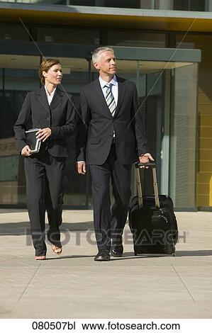 full body portrait of mature businesswoman and businessman leaving office building View Large Photo Image Stock Image - full body portrait of mature businesswoman and businessman leaving office building. Fotosearch