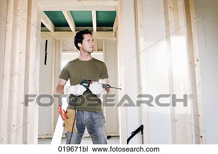 full body portrait of young man standing in door of house under construction View Large Photo Image Stock Image - full body portrait of young man standing in door of house under construction. Fotosearch