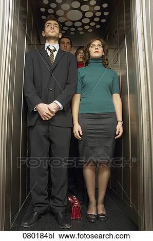 group of business people standing in elevator View Large Photo Image Stock Image - group of business people standing in elevator. Fotosearch