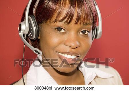 headshot of black businesswoman wearing headset View Large Photo Image Stock Image - headshot of black businesswoman wearing headset. Fotosearch