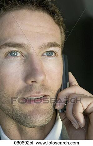 headshot of business talking on mobile phone View Large Photo Image Stock Image - headshot of business talking on mobile phone. Fotosearch