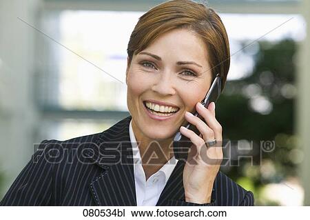 headshot of mature businesswoman talking on mobile phone View Large Photo Image Stock Image - headshot of mature businesswoman talking on mobile phone. Fotosearch