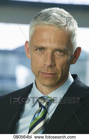 Stock Image - headshot of mature executive. Fotosearch