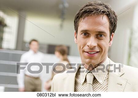 headshot of smiling businessman in office space View Large Photo Image Stock Image - headshot of smiling businessman in office space. Fotosearch