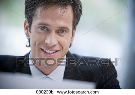 headshot of smiling businessman View Large Photo Image Stock Image - headshot of smiling businessman. Fotosearch