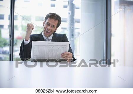 joyous businessman reading stock market report in business paper View Large Photo Image Stock Image - joyous businessman reading stock market report in business paper. Fotosearch