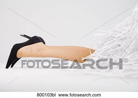 legs of young woman buried under shredded paper View Large Photo Image Stock Image - legs of young woman buried under shredded paper. Fotosearch