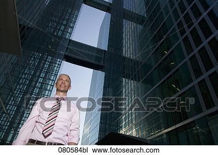 low angle portrait of mature businessman in front of office building View Large Photo Image Stock Image - low angle portrait of mature businessman in front of office building. Fotosearch