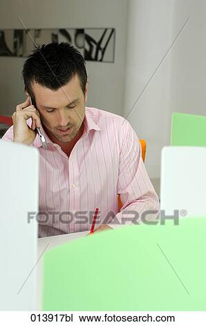 office worker taking some notes during phone conversation View Large Photo Image Stock Image - office worker taking some notes during phone conversation. Fotosearch