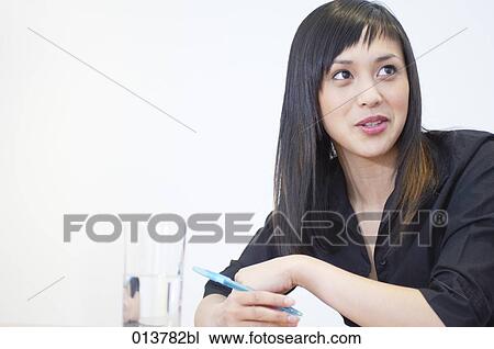 portrait of asian woman having a conversation in business meeting View Large Photo Image Stock Image - portrait of asian woman having a conversation in business meeting. Fotosearch