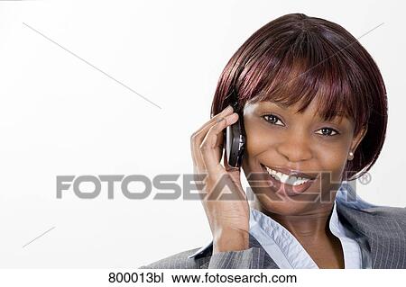 Stock Image - portrait of black businesswoman with mobile phone. Fotosearch