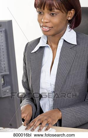 portrait of black businesswoman working with computer View Large Photo Image Stock Image - portrait of black businesswoman working with computer. Fotosearch