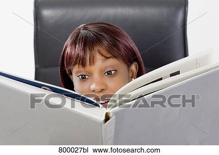 portrait of black woman reading book View Large Photo Image Stock Image - portrait of black woman reading book. Fotosearch