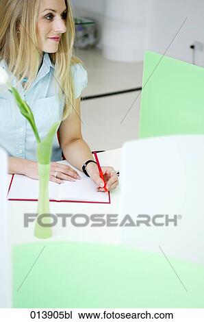 portrait of blonde businesswoman writing notes View Large Photo Image Stock Image - portrait of blonde businesswoman writing notes. Fotosearch