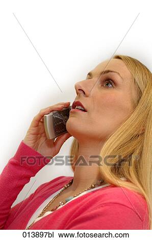 portrait of blonde woman talking on mobile phone View Large Photo Image Stock Image - portrait of blonde woman talking on mobile phone. Fotosearch