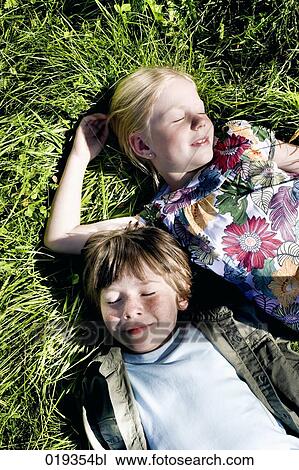 portrait of brother and sister dozing in grass View Large Photo Image Stock Image - portrait of brother and sister dozing in grass. Fotosearch