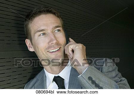 portrait of bunessman listening to mobile phone View Large Photo Image Stock Image - portrait of bunessman listening to mobile phone. Fotosearch