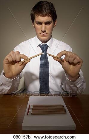 portrait of businessman breaking pencil View Large Photo Image Stock Image - portrait of businessman breaking pencil. Fotosearch