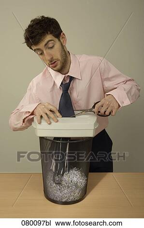 portrait of businessman cutting tie which has been eaten by shredder View Large Photo Image Stock Image - portrait of businessman cutting tie which has been eaten by shredder. Fotosearch