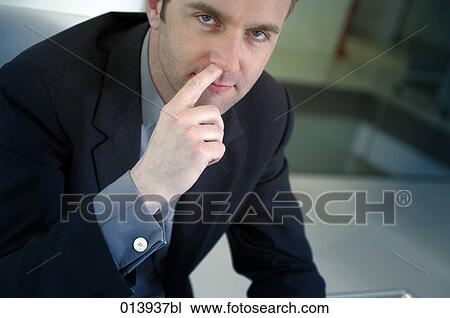portrait of businessman picking his nose View Large Photo Image Stock Image - portrait of businessman picking his nose. Fotosearch