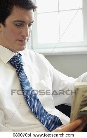 portrait of businessman reading newspaper View Large Photo Image Stock Image - portrait of businessman reading newspaper. Fotosearch