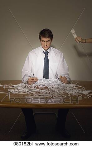 portrait of businessman sitting in front of shredded paper with female hand giving him telephone View Large Photo Image Stock Image - portrait of businessman sitting in front of shredded paper with female hand giving him telephone. Fotosearch