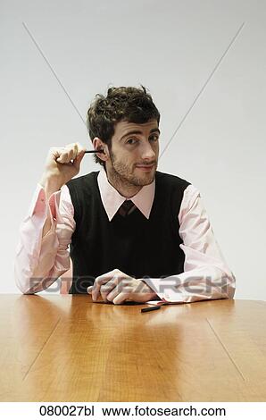 portrait of businessman sticking pencil into ear View Large Photo Image Stock Image - portrait of businessman sticking pencil into ear. Fotosearch