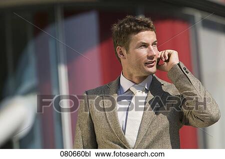 portrait of businessman talking on mobile phone outdoors View Large Photo Image Stock Image - portrait of businessman talking on mobile phone outdoors. Fotosearch