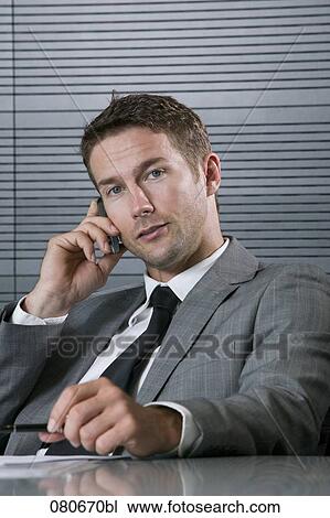 portrait of businessman talking on mobile phone View Large Photo Image Stock Image - portrait of businessman talking on mobile phone. Fotosearch