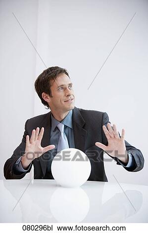 portrait of businessman with crystal ball View Large Photo Image Stock Image - portrait of businessman with crystal ball. Fotosearch