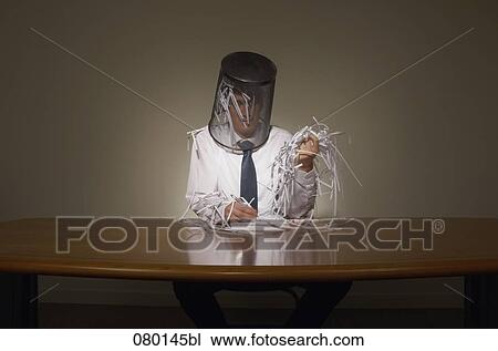 Stock Image - portrait of businessman with empty wastebasket over his head. Fotosearch